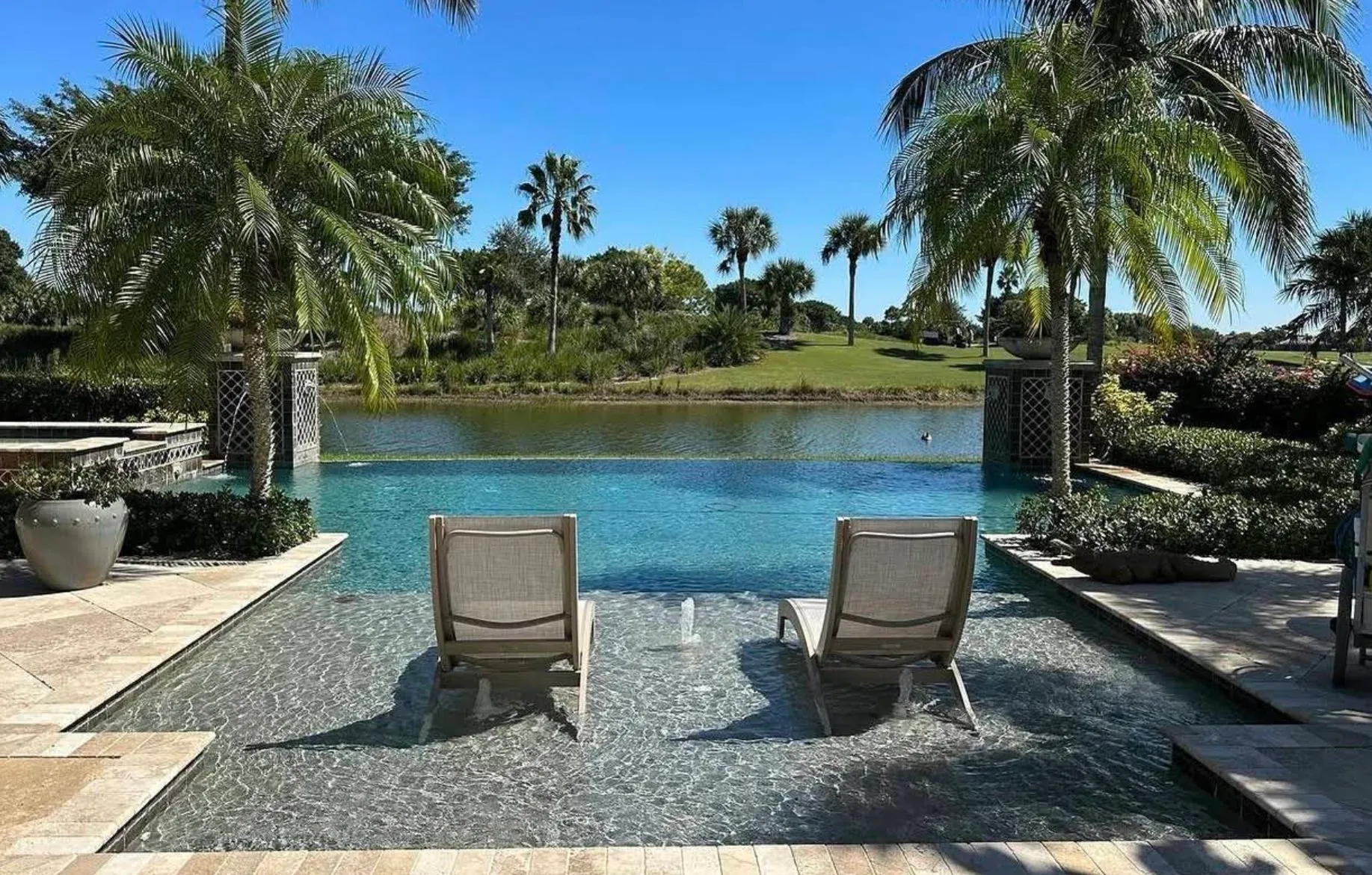 Yeah, those are lounge chairs IN the pool — this Jupiter client knows how to live