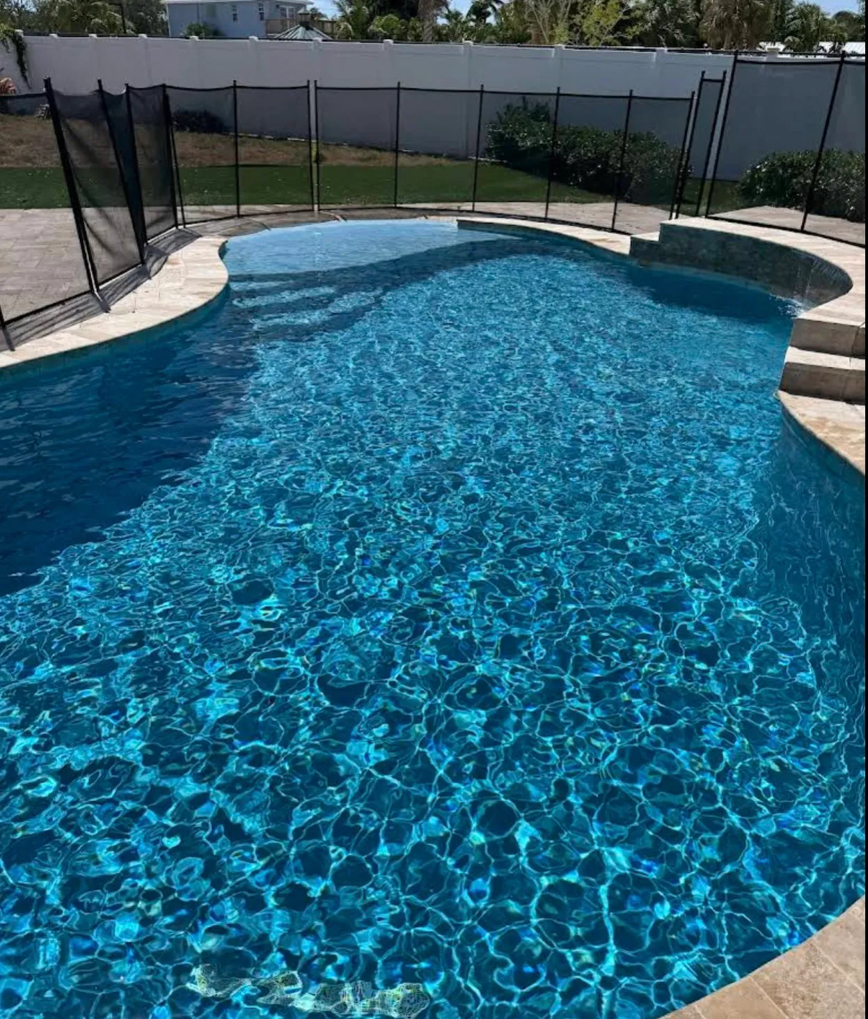 That water is so clear you can count the tiles from the deck